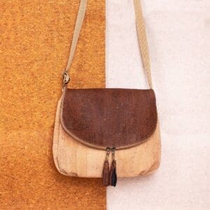 Beige and brown crossbody bag with tassels.