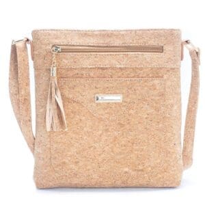 Cork crossbody bag with zipper and tassel.