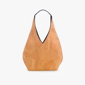 Tan cork handbag with black handle.