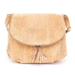 Beige cork handbag with tassels and strap.