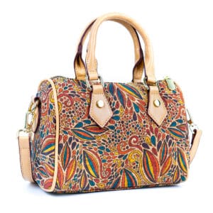 Colorful patterned handbag with leather straps.