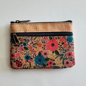 Floral patterned pouch with zipper closure.